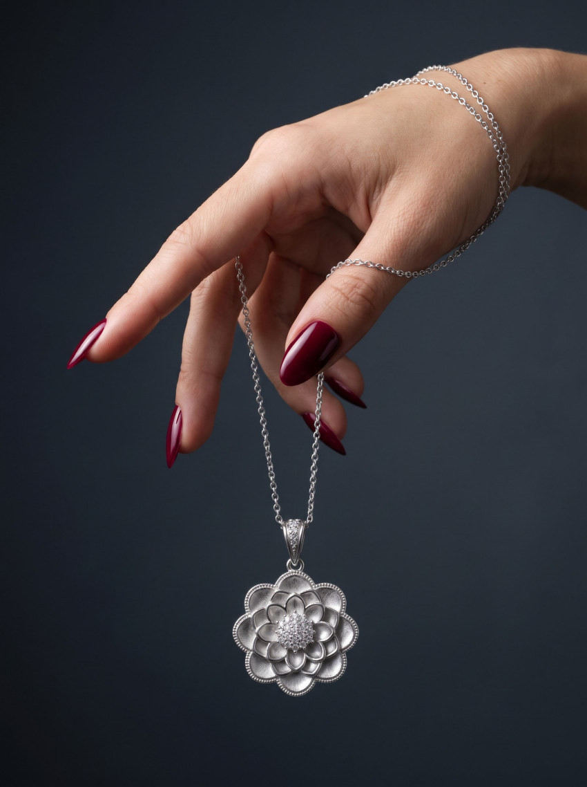 Gold Pendant Suspended by Hand Jewelry Photography Prompt - Example 2