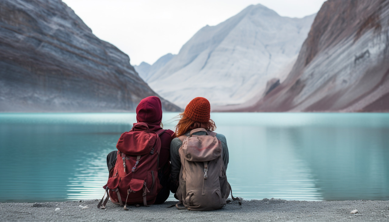 Two hikers enjoying the peace and quiet of a mountain lake, adventure travel stock images, adventure travel ai prompts, travel stock images ai