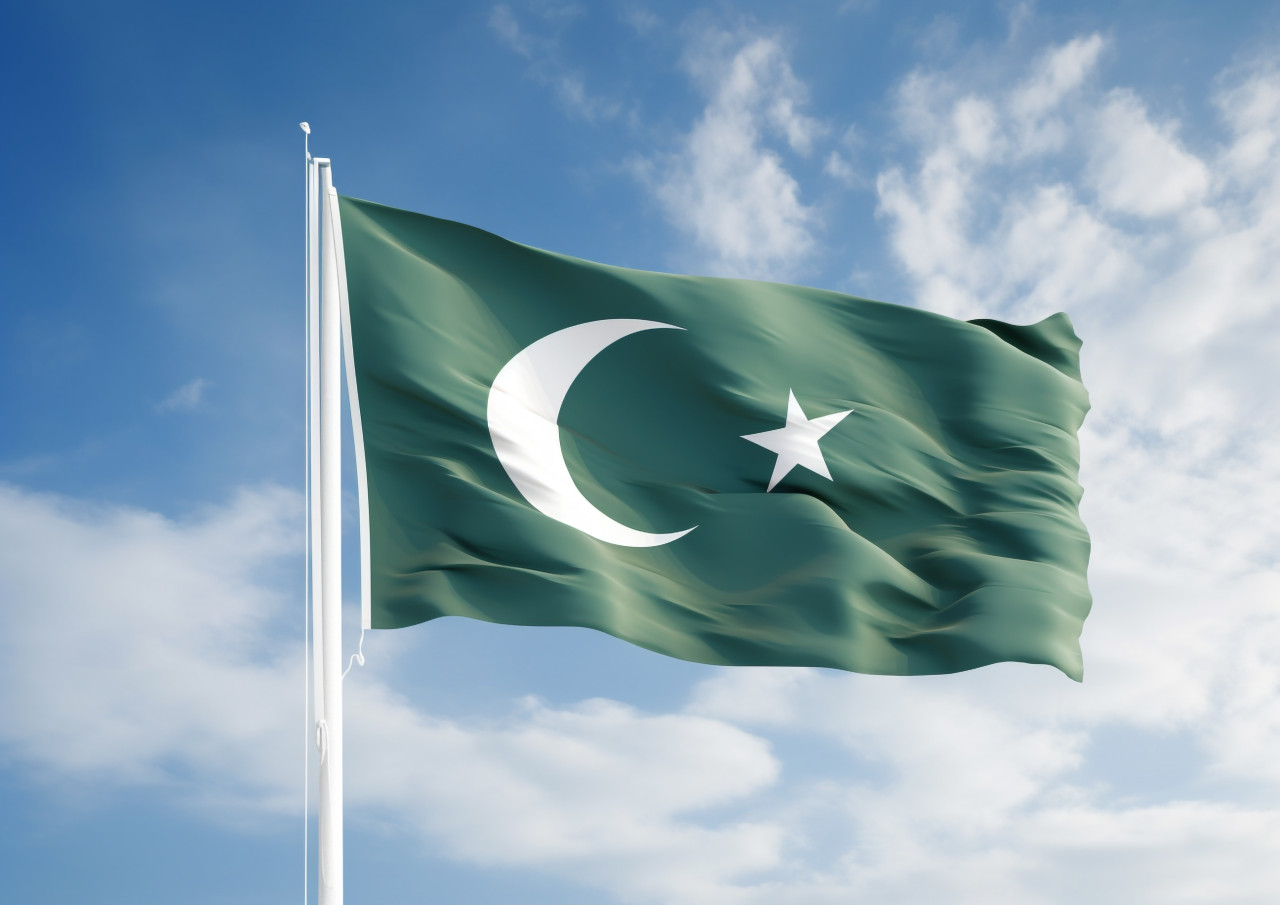 Pakistan flag against a clear blue sky, pakistan independence day photos
