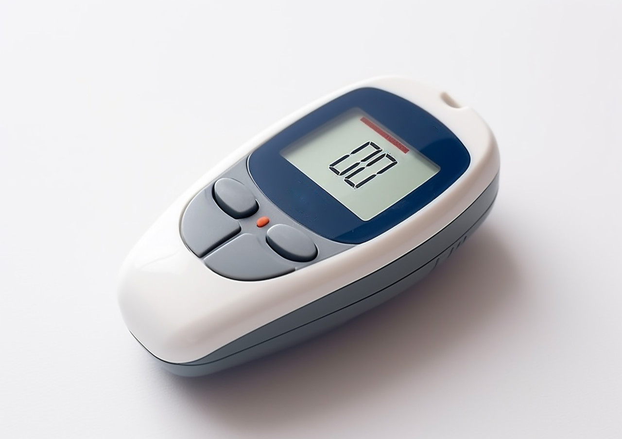 Checking blood sugar with a glucose monitor, diabetes concept
