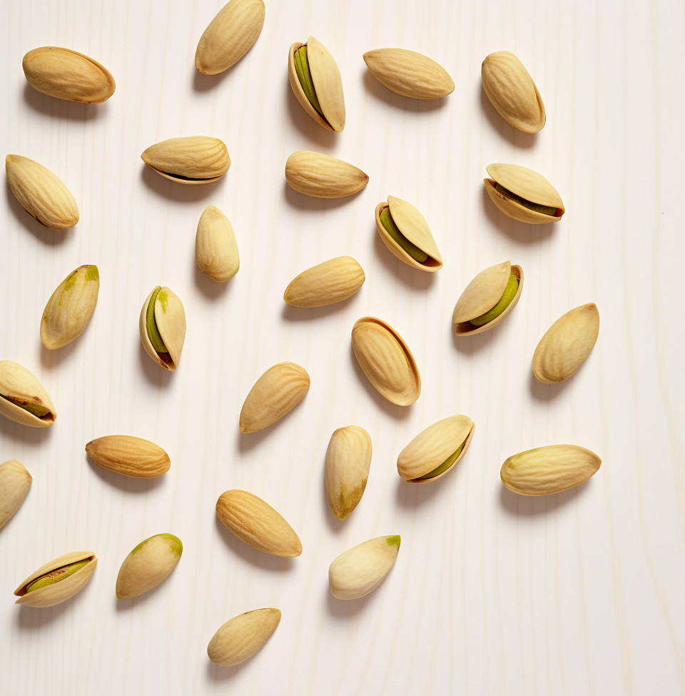 Several pistachios on a white background, pistachio nut image