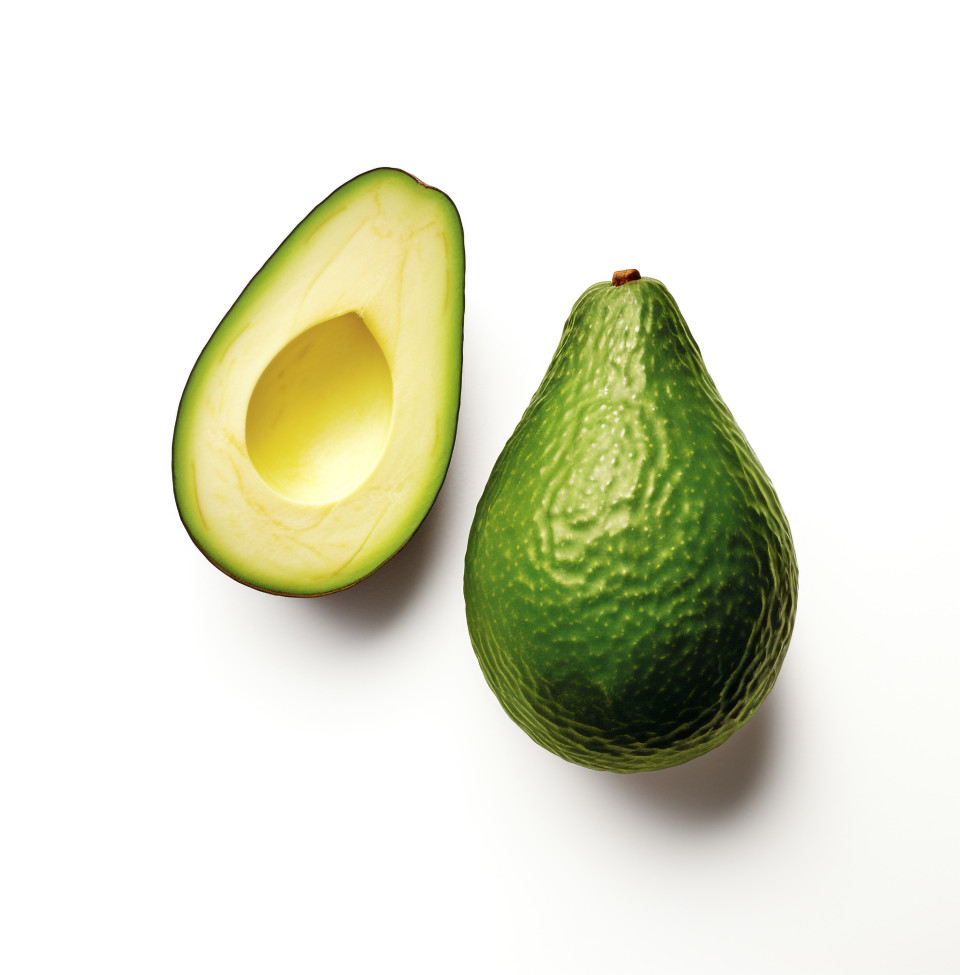 Closeup of cut avocado half, avocado image stock photo