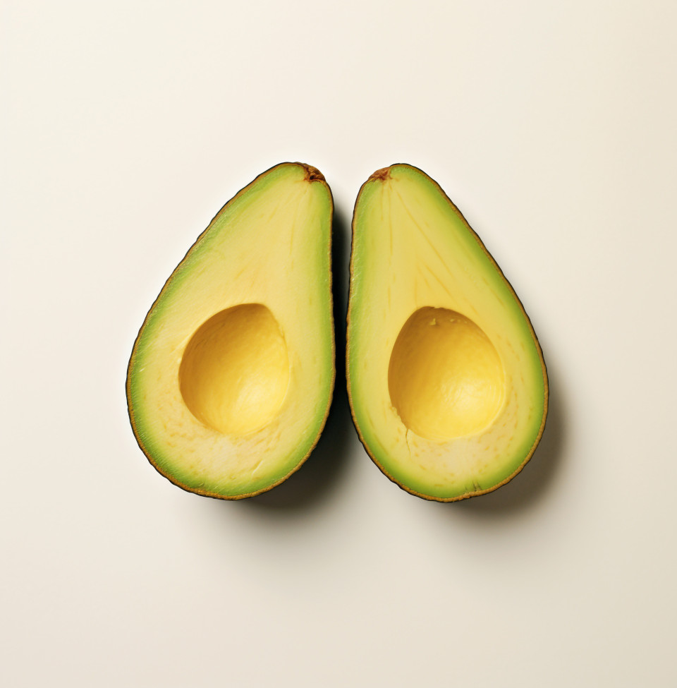 Avocado cut in half on white background, avocado image stock photo
