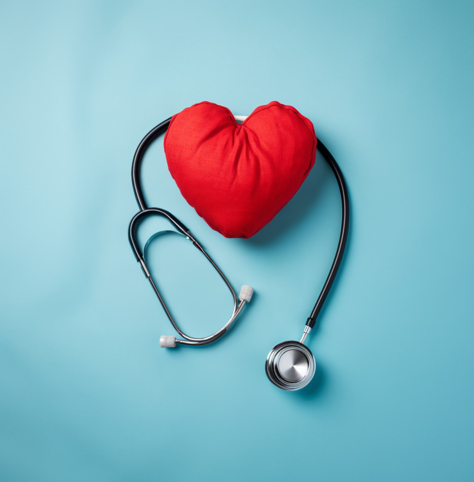 Heart and stethoscope on blue background, medical images stock