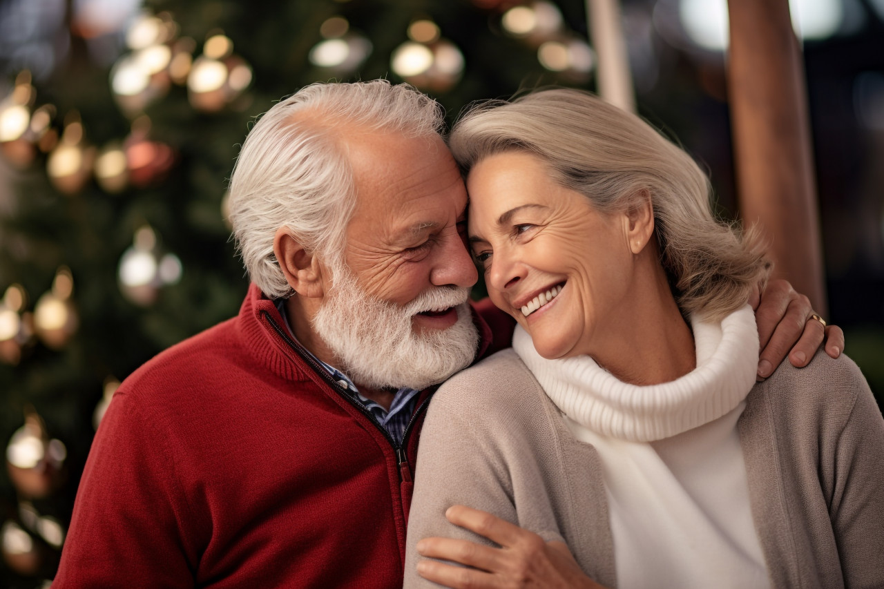 Happy older couple hugging dreaming of the future