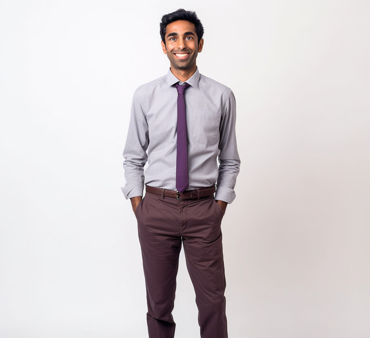Smiling indian male kindergarten teacher on white background