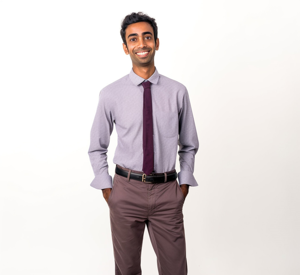 Smiling indian male kindergarten teacher on white background