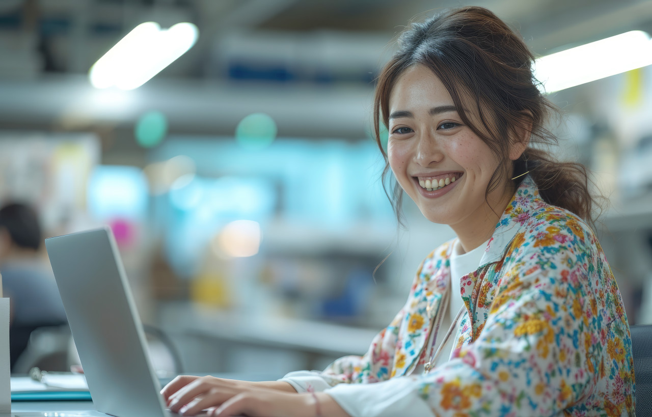 Office professional women happily working on laptop, accountability image