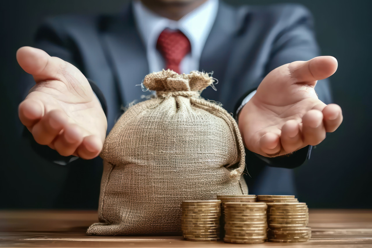 Businessman denies money bag rejecting loan due to bad credit facing financial difficulties refusal to cooperate amidst economic sanctions in an office setting, financial difficulties photo