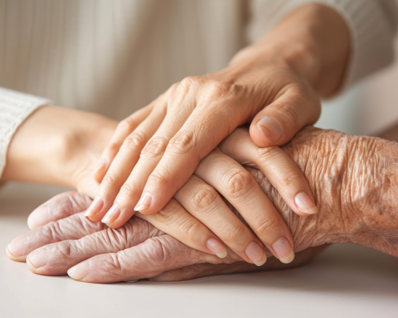Mature wife or carer holding aged husband hands expressing care and support, age acceptance concept