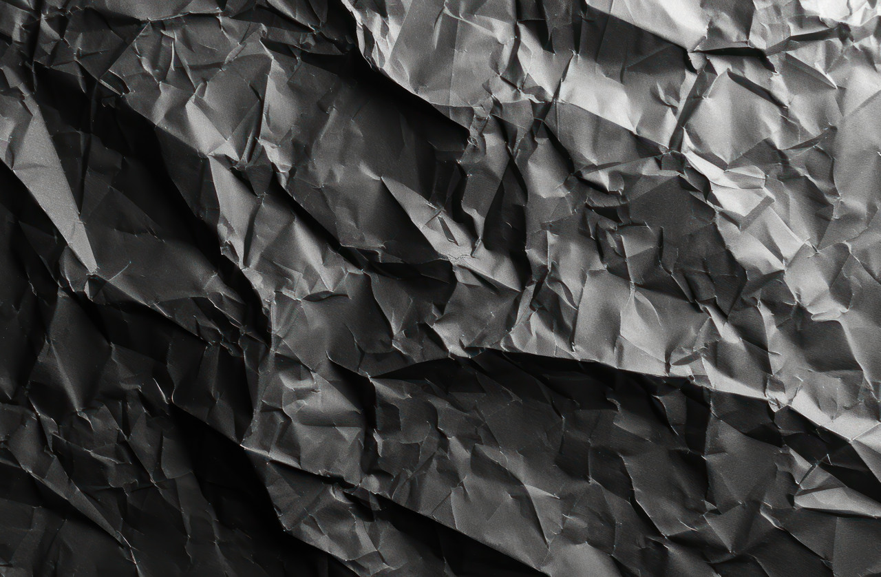 Texture of crumpled black paper background, crumpled paper texture photo