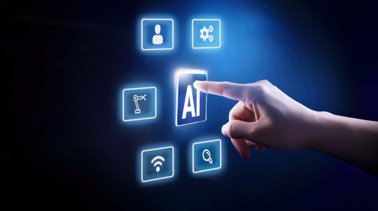 Hand touching ai icon on screen with plain background illustrating technology concept