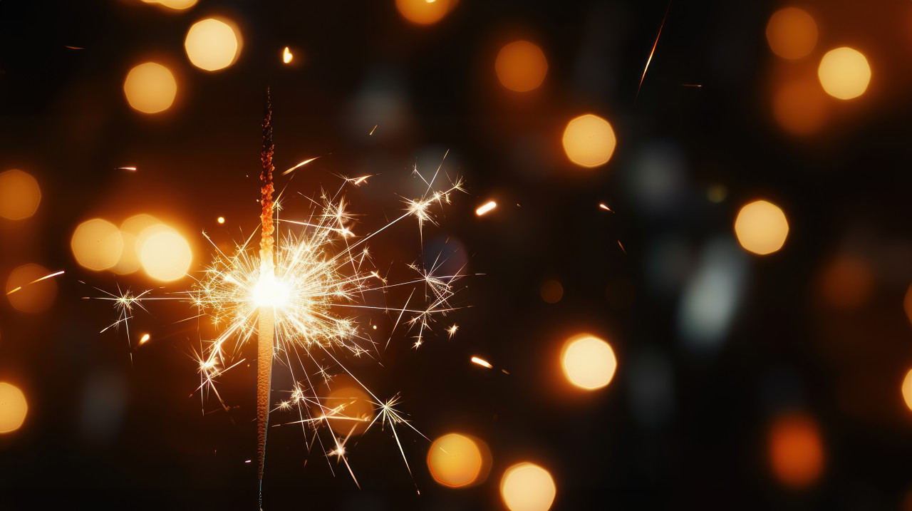 Close up of a sparkler burning creating an elegant and festive atmosphere against a dark background celebrating diwali, festival of lights, diwali sparkler