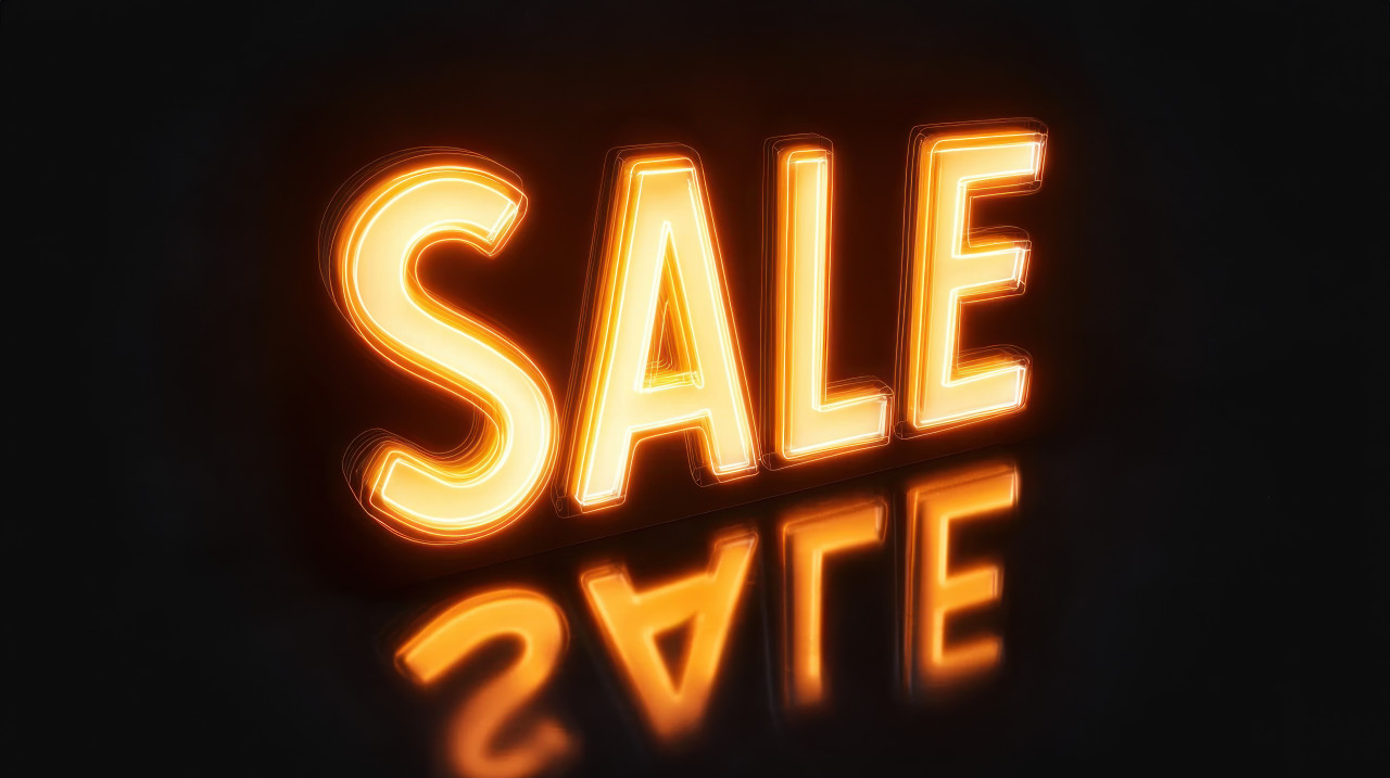 Glowing sale text on black background advertising sale event promoting discounts and offers