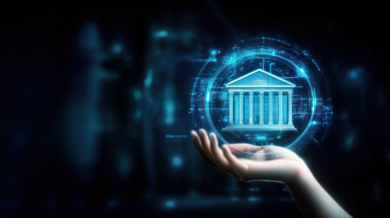 Hand holding a bank building icon surrounded by digital data, representing financial literacy, banking management, digital financial tools