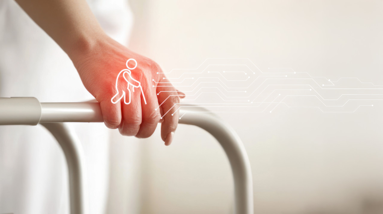 A close up of a nurse holding an elderly person hand on a walker, geriatric therapy highlights support and safety in mobility assistance with geriatric icons