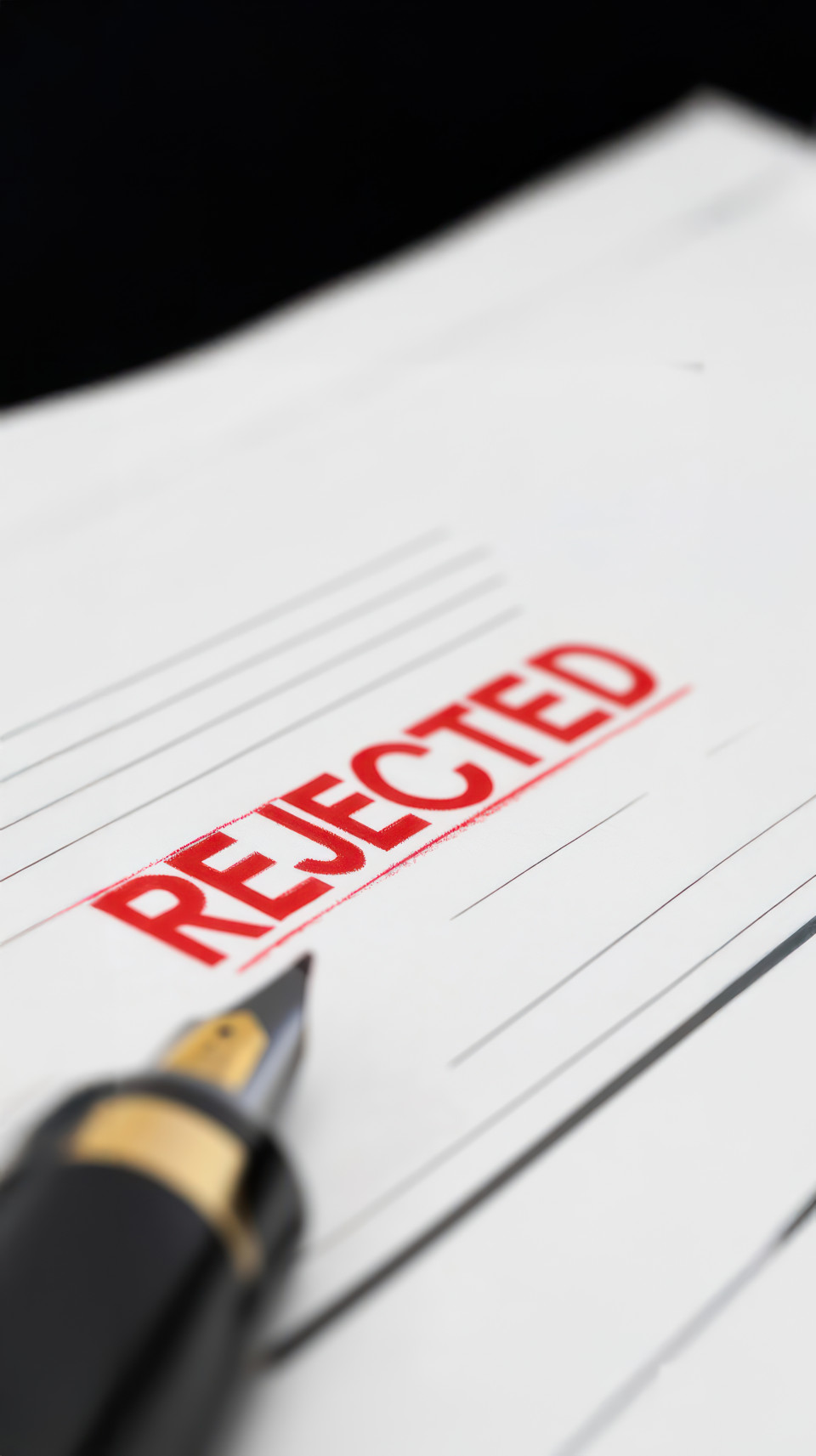 Pen writing the word rejected on paper in red ink with a stamped effect symbolizing visa denial, visa rejection, visa refusal, visa denied document theme