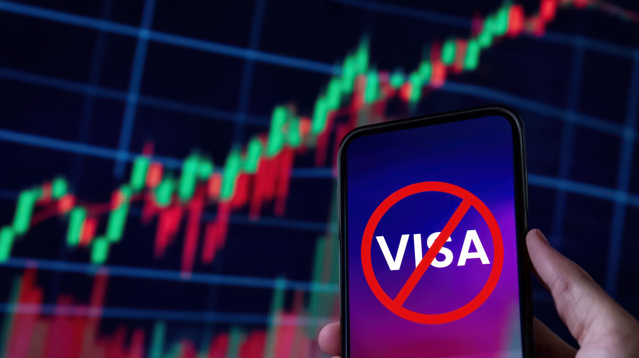 Hand holding a phone displaying visa text on the screen symbolizing a visa denial process, visa rejection, visa refusal, visa denied digital theme