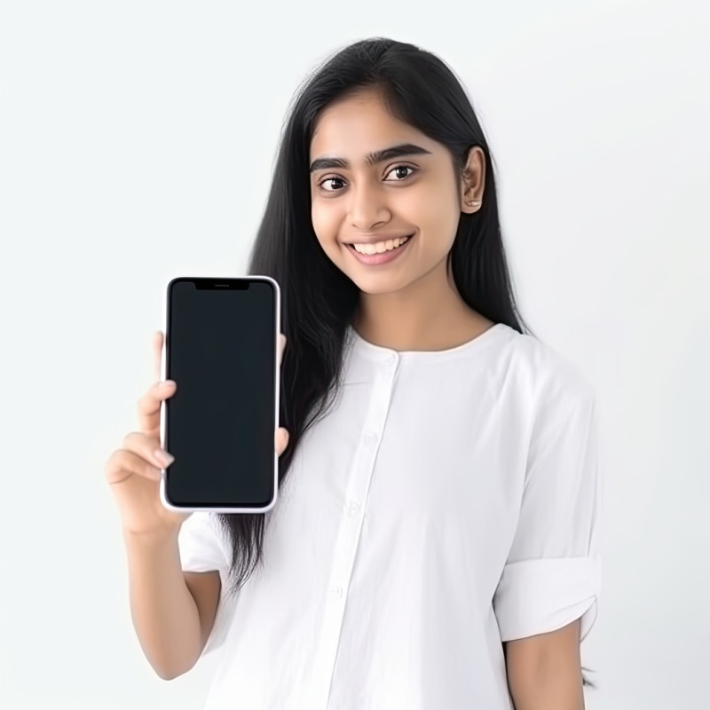 Excited young indian woman holding a big smartphone with a white blank screen, ideal for stock photos and mobile advertisements