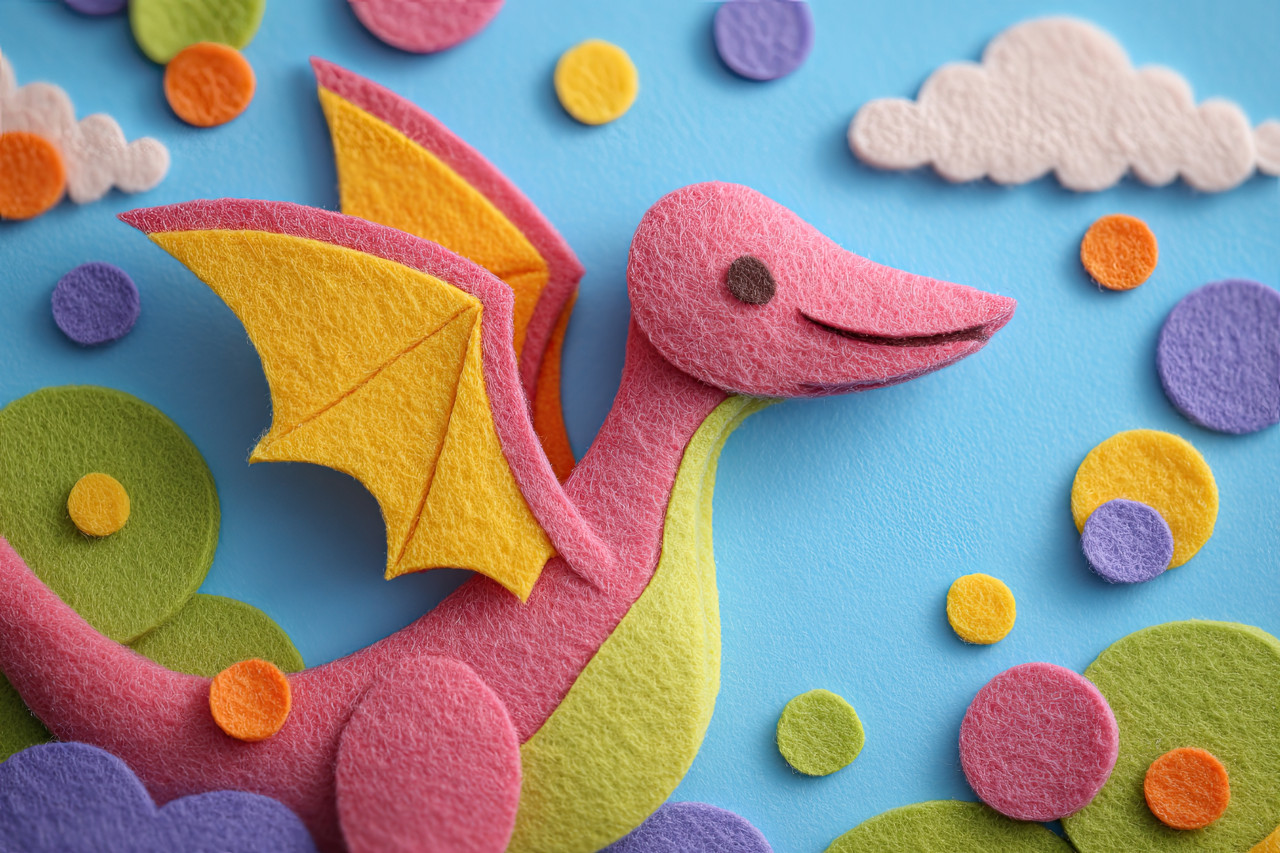 Smiling baby pterodactyl flaps wings with joy in soft felt sky full of clouds. prehistoric felt art, whimsical toy world, soft toy illustration for playrooms