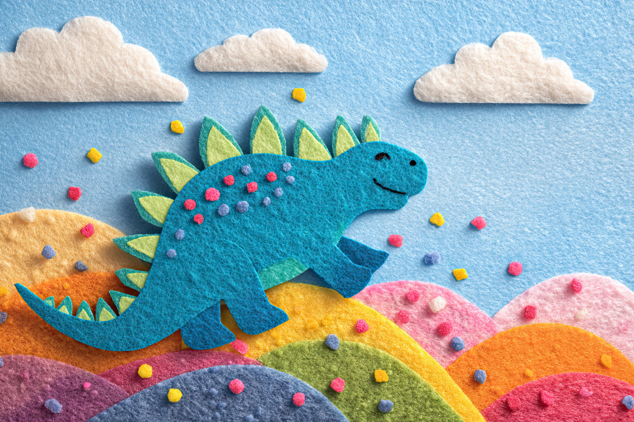 Happy stegosaurus slides down grassy hill with confetti flying, layered in soft felt. prehistoric felt art, whimsical toy world, soft toy illustration for kids