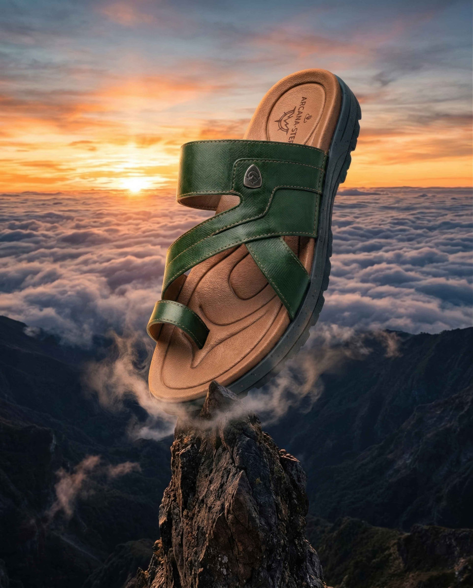 Sandal standing on rock peak above clouds sunrise scene google gemini prompt