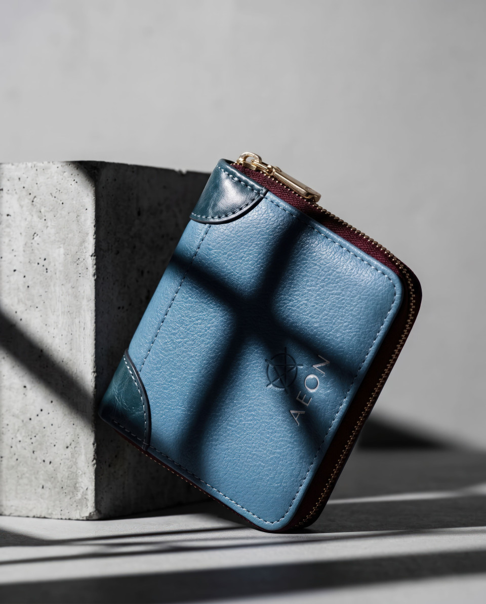 Minimal leather wallet on concrete block with hard shadows google gemini prompt