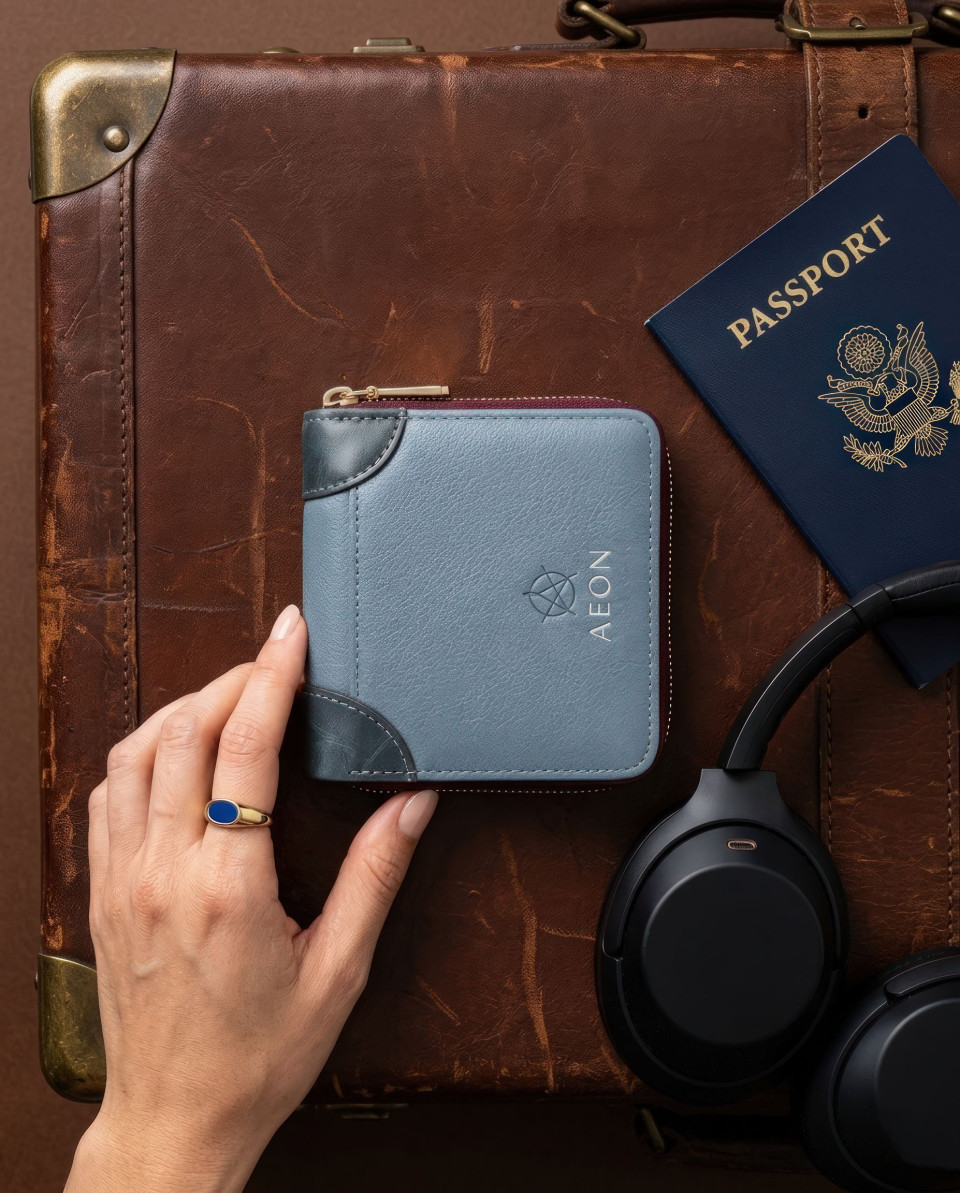 Travel wallet flat lay with passport headphones suitcase google gemini prompt