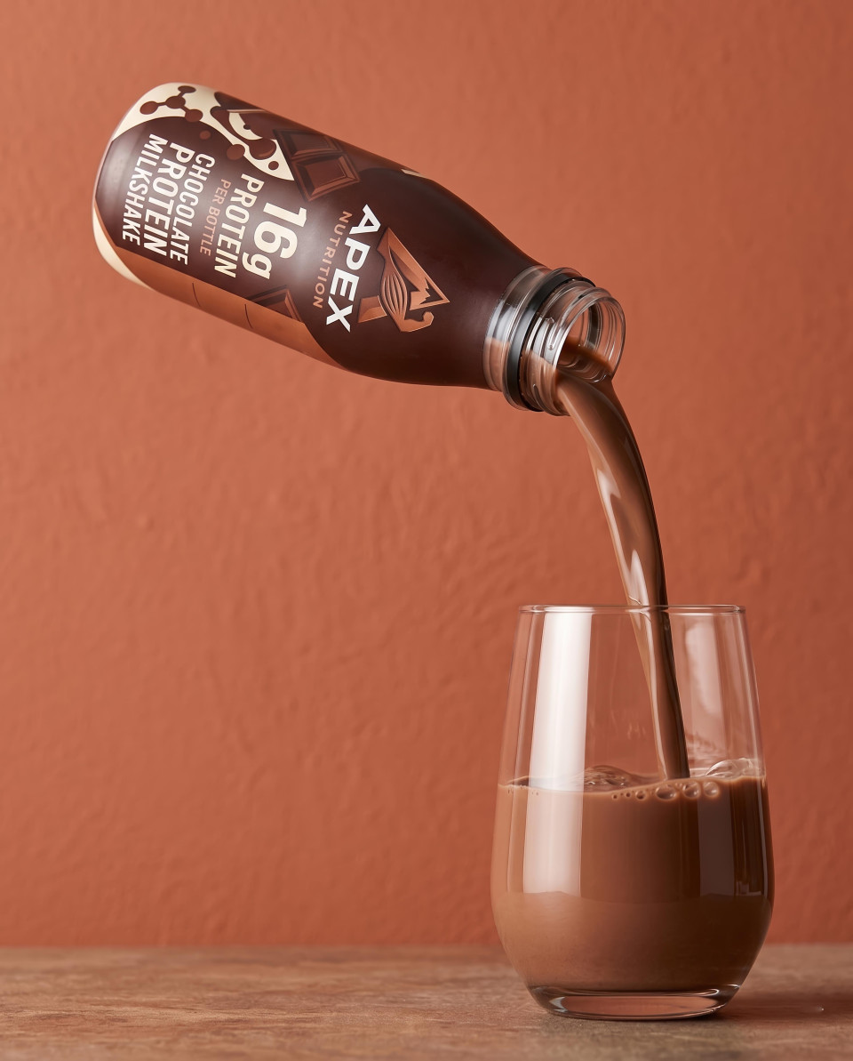 Pouring chocolate drink from protein bottle macro shot google gemini prompt