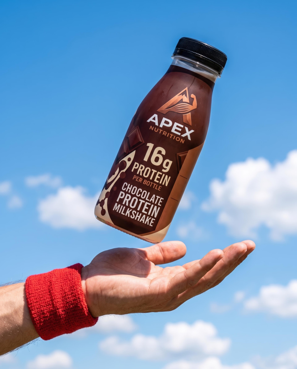 Floating protein bottle above hand against blue sky google gemini prompt