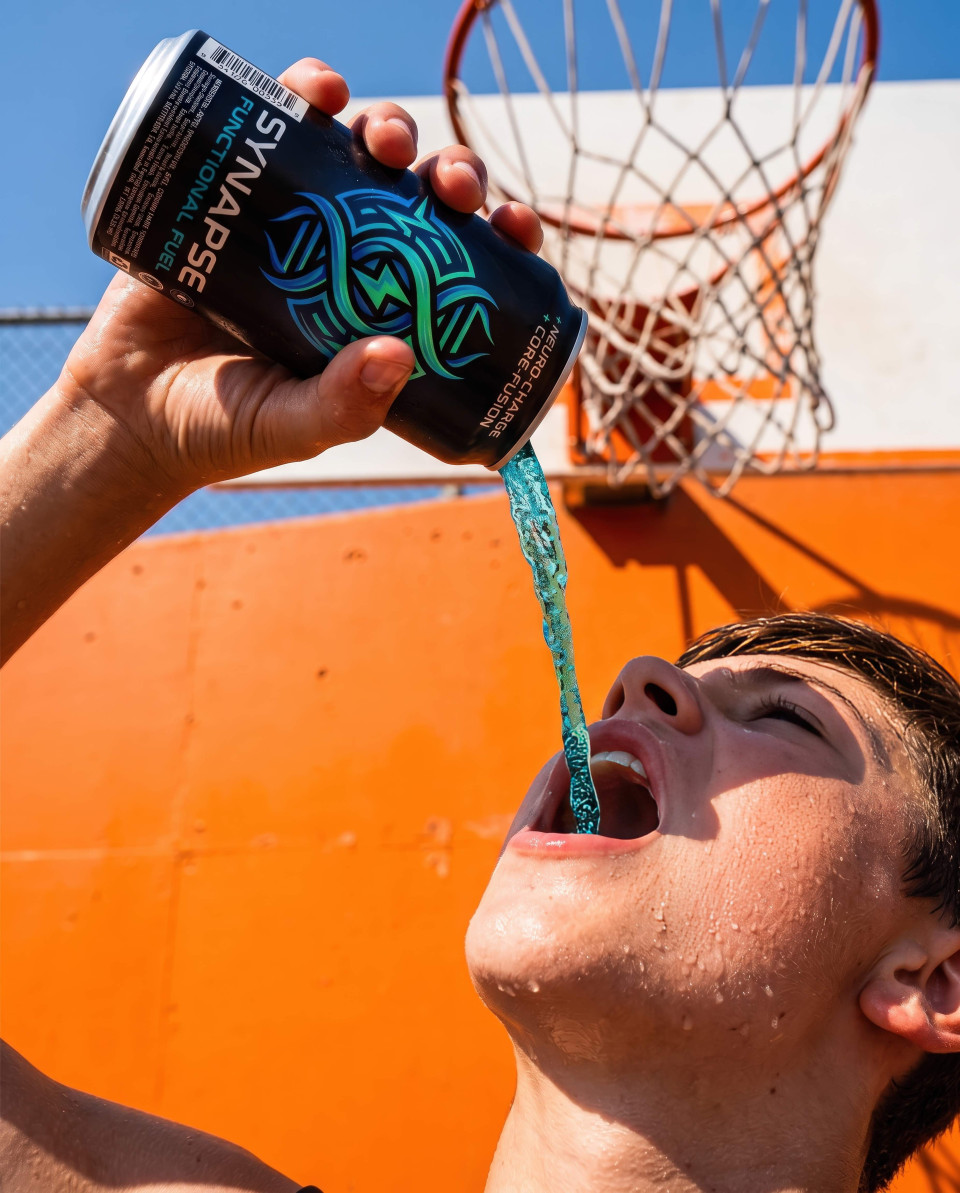 Energy drink being poured in action on outdoor basketball court google gemini prompt