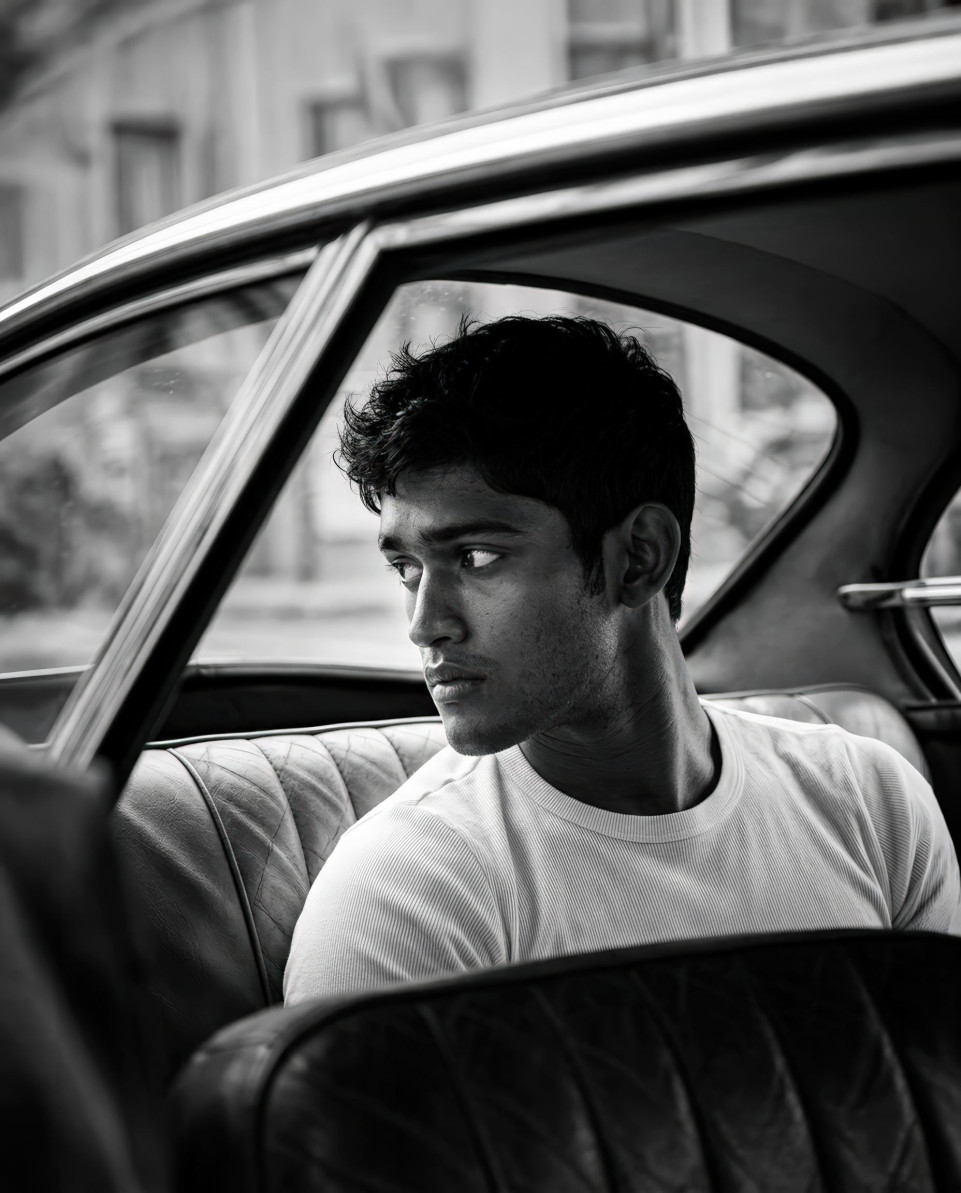 Cinematic black and white man in retro coupe car google gemini prompt
