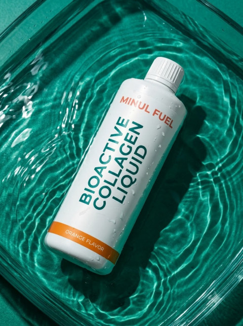 Collagen Liquid Bottle Water Ripples Overhead