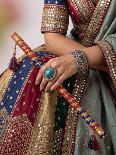 Dandiya Sticks & Statement Silver Ring AI Product Photography Prompt Festive Flat-Lay Angle