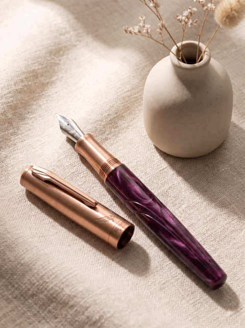 Fountain Pen Flat Lay on Linen with Ceramic Vase