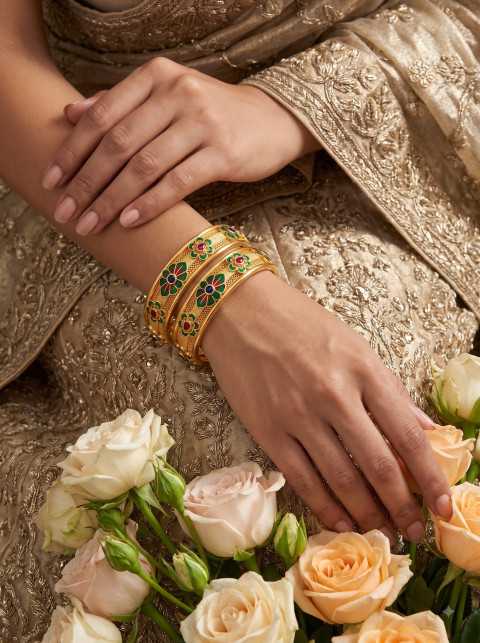 Gold Enamel Bangles on Indian Bridal Hands with Roses