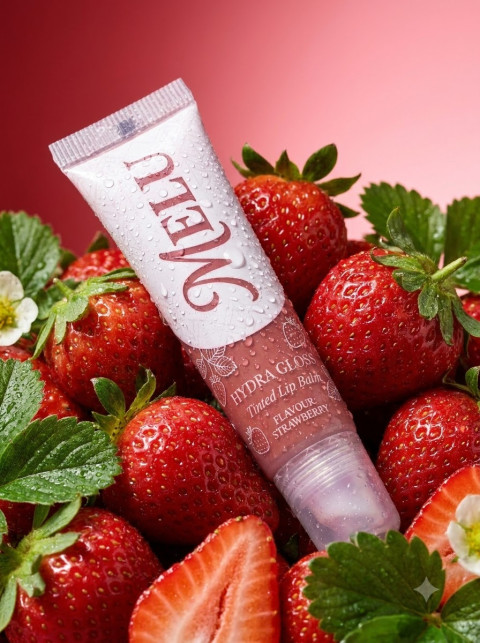 Lip Balm Tube Macro Shot with Water Droplets and Strawberries