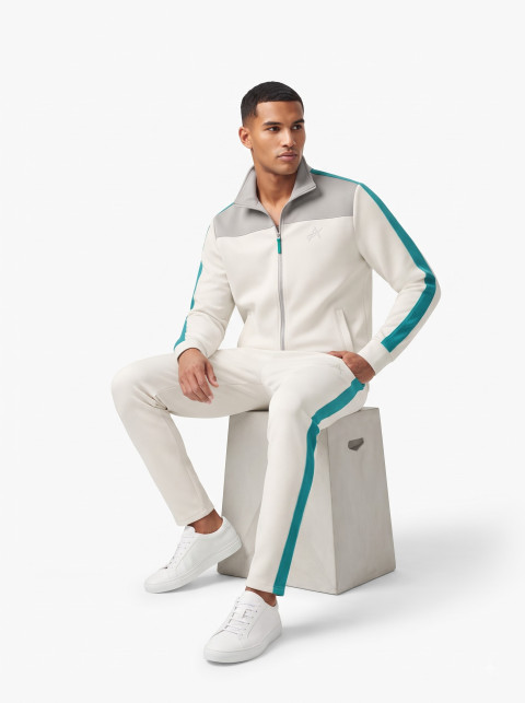 Seated Male Model in Track Suit Studio Shot