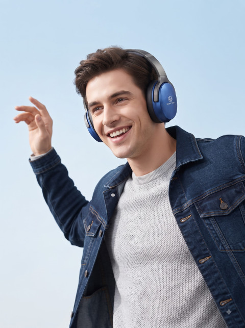 Wireless Headphone Lifestyle Shot of Smiling Man in Denim Jacket